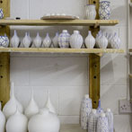 Rhian Malin decorating a mandala bottle in her workshop 2019